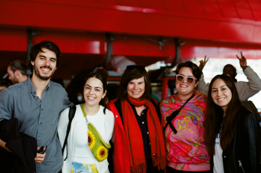 A small group of Summer Institute participants pose for a picture in an indoor location.